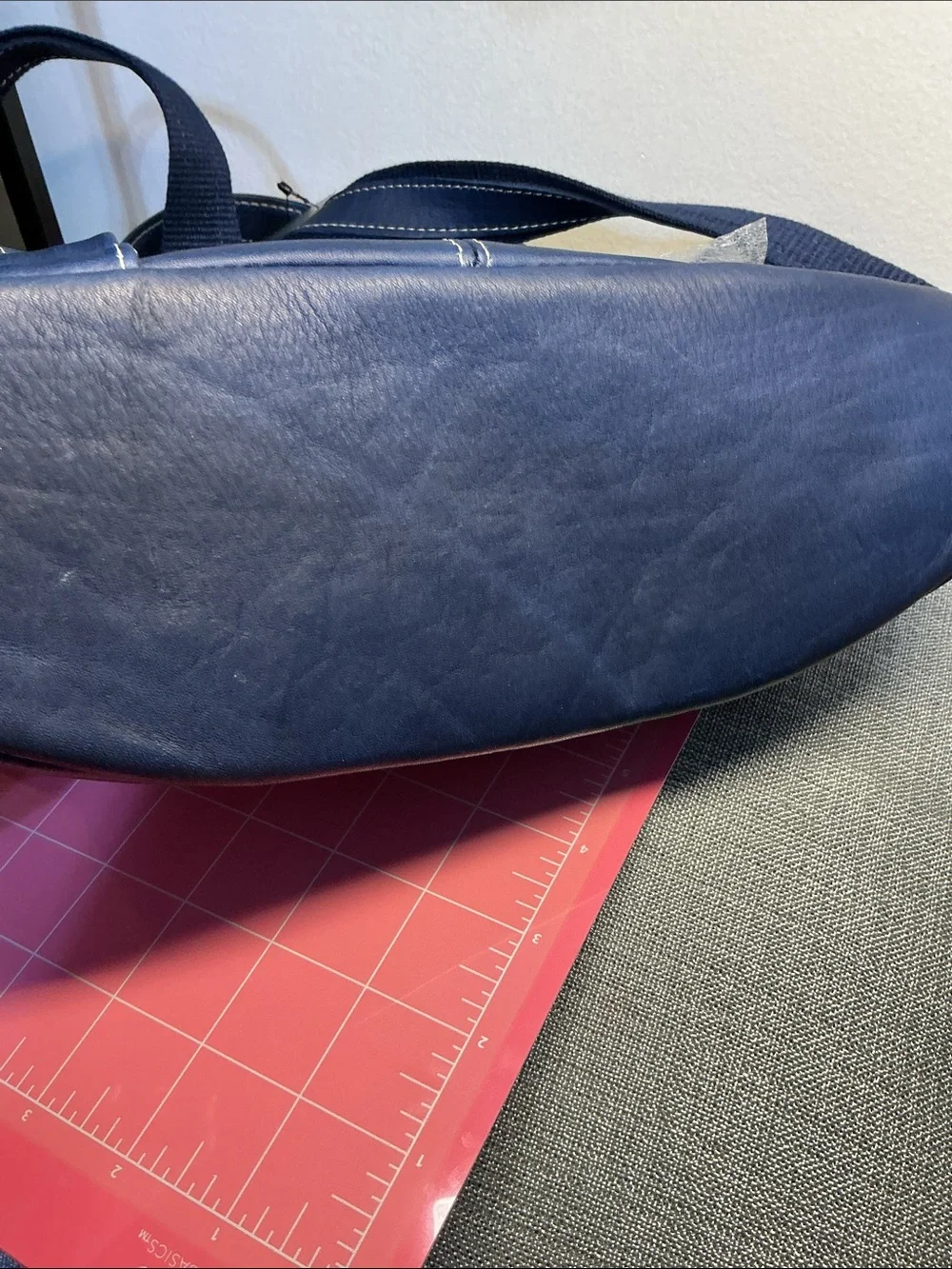 Navy blue leather backpack